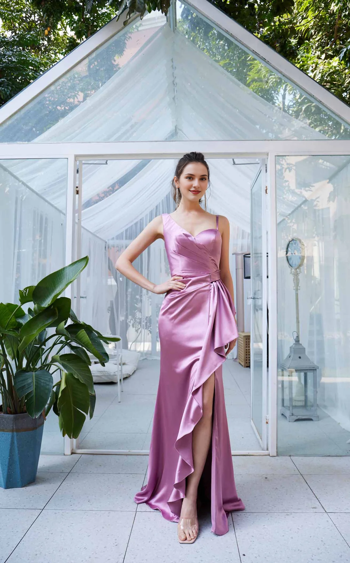 Asymmetric neckline with ruffled edges and side slits as well as a floor length evening dress