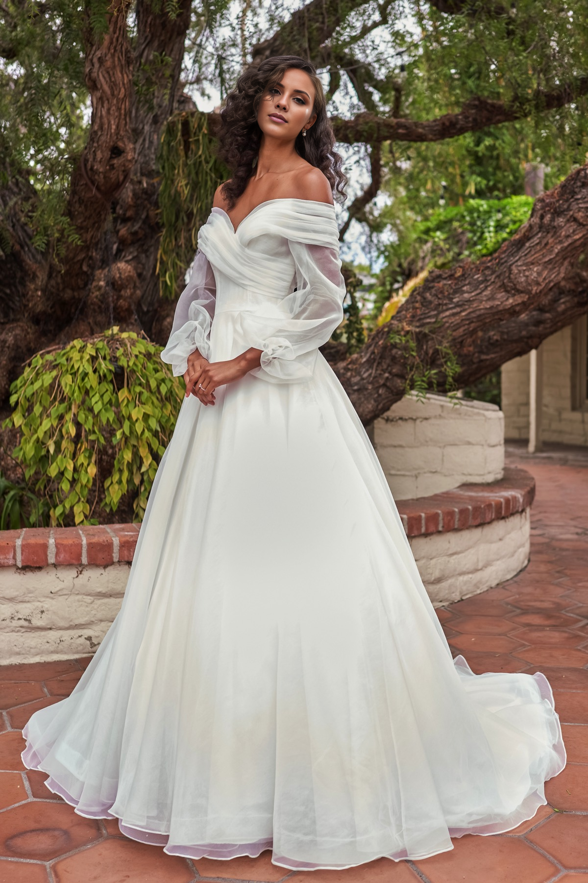 V-neckline slim fit waistline long sleeved and floor length wedding dress