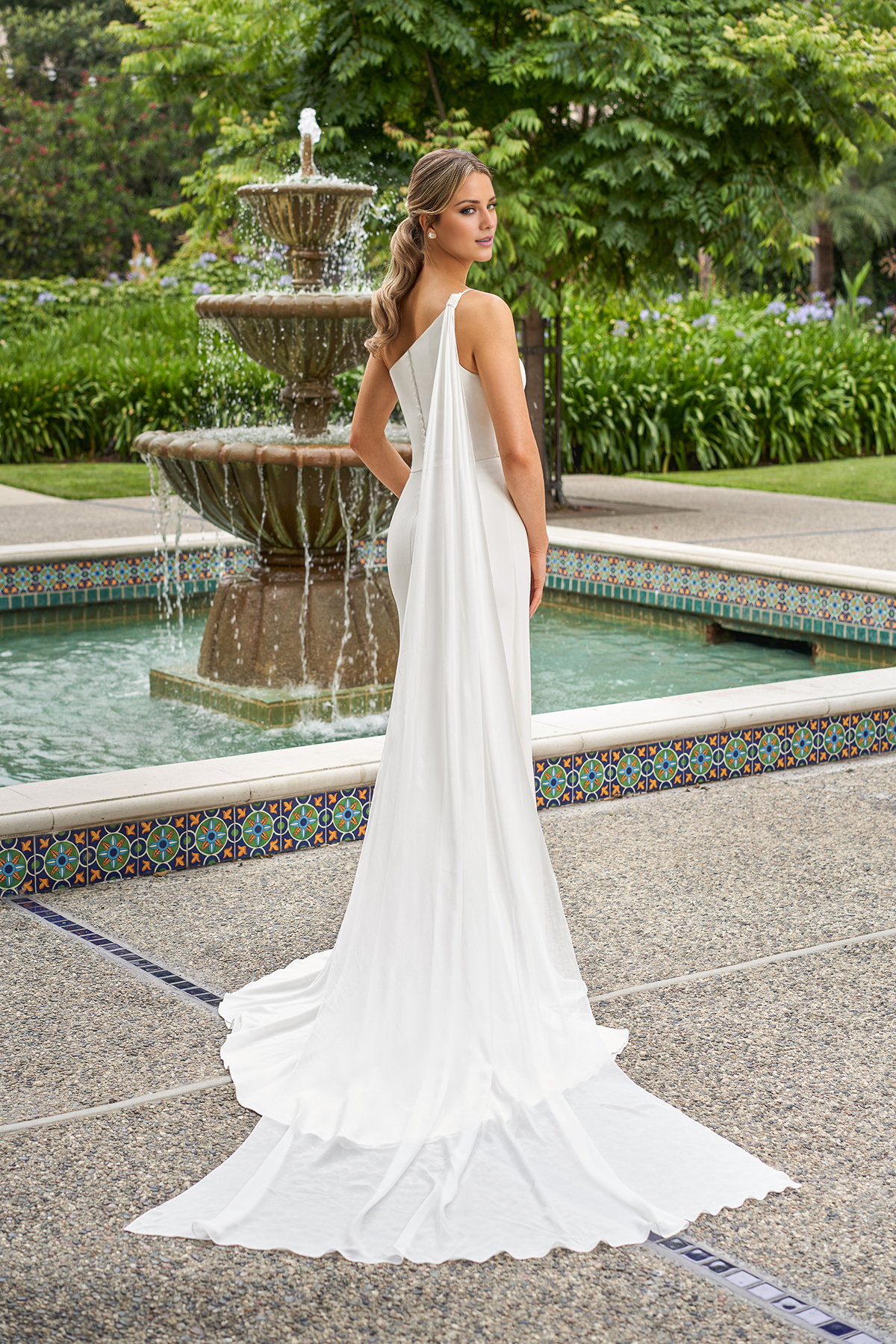 One shoulder fitted trumpet shaped crepe and floor length wedding dress