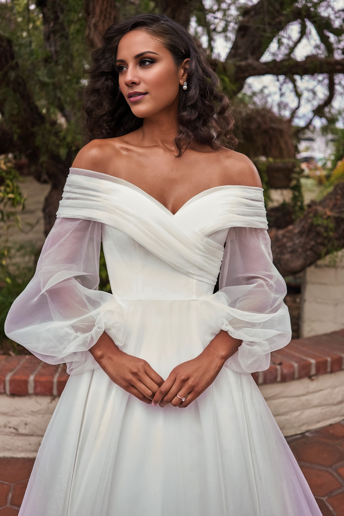 V-neckline slim fit waistline long sleeved and floor length wedding dress