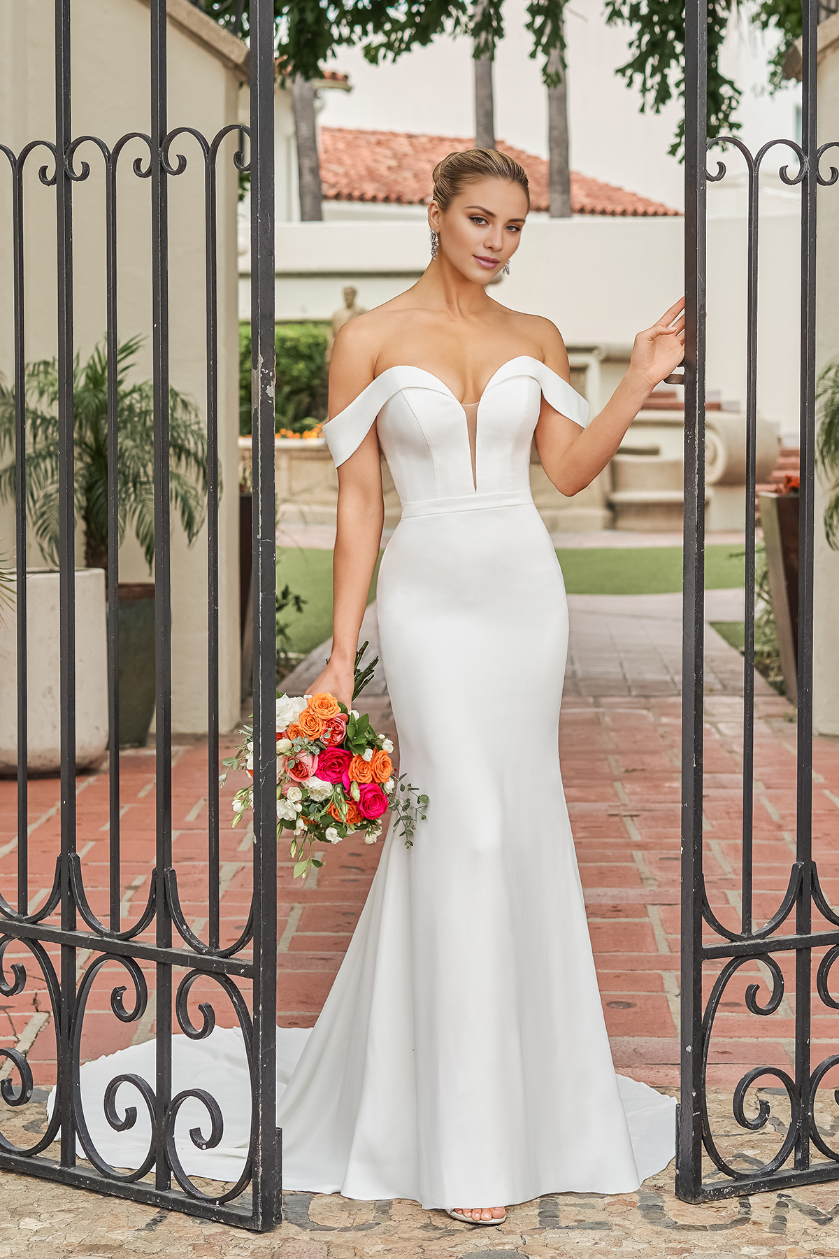 Off shoulder collar with fitted horn and floor length wedding dress