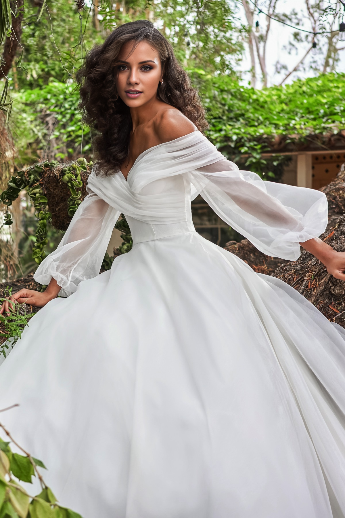 V-neckline slim fit waistline long sleeved and floor length wedding dress