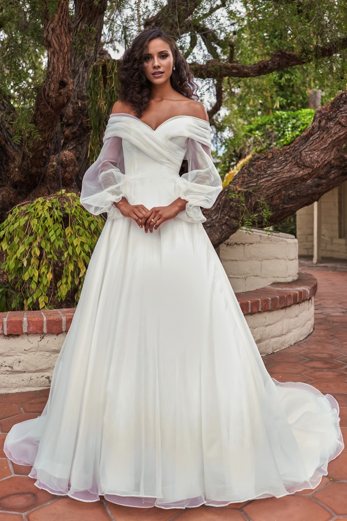 V-neckline slim fit waistline long sleeved and floor length wedding dress