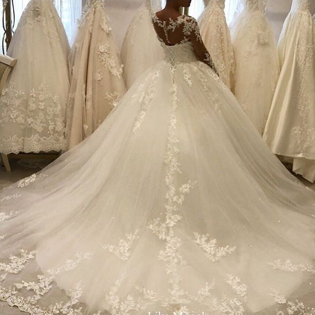 Elegant Long Sleeves Appliques Wedding Dress with Chic Lace Ruffles